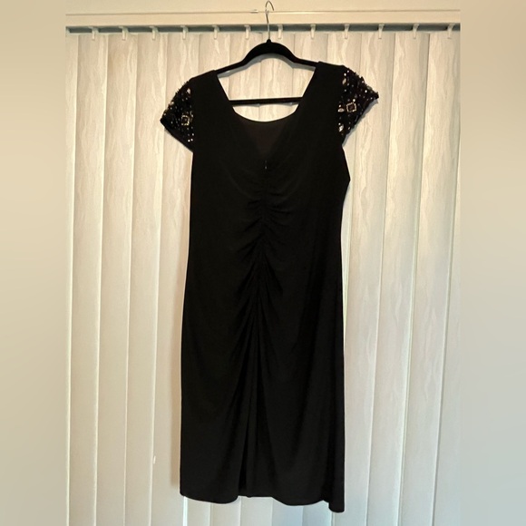 Elegant Black Dress with Embellished Sleeves - Picture 5 of 10